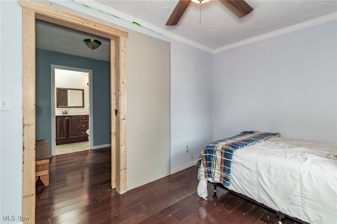 9723 Thwing Road Chardon, OH 44024 - Photo 24 of 42 Bedroom with wood finished floors, crown molding, and a ceiling fan