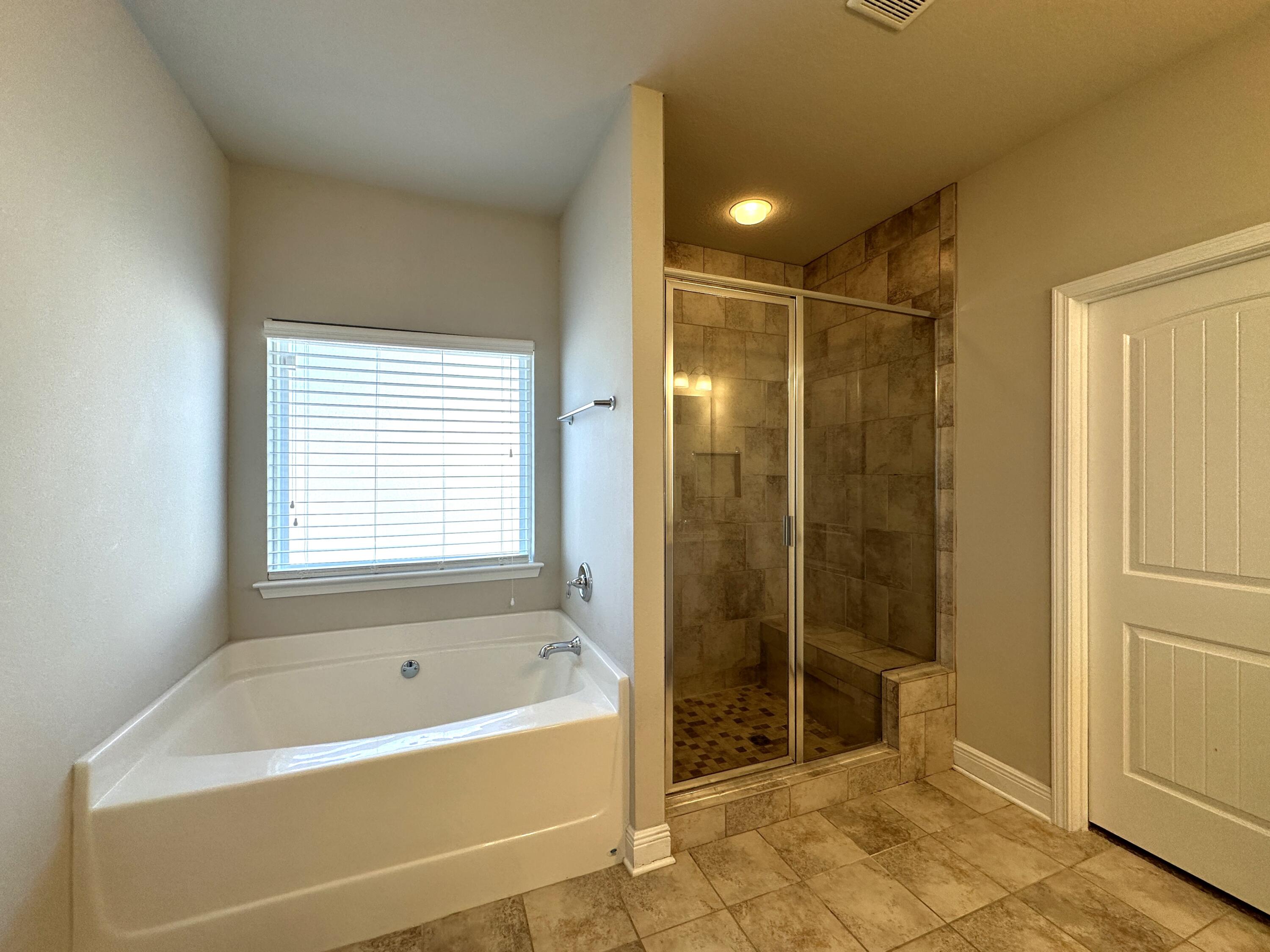 513 Gadwell Street Crestview, FL 32539 - Photo 19 of 35 a bathroom with a bathtub and a shower