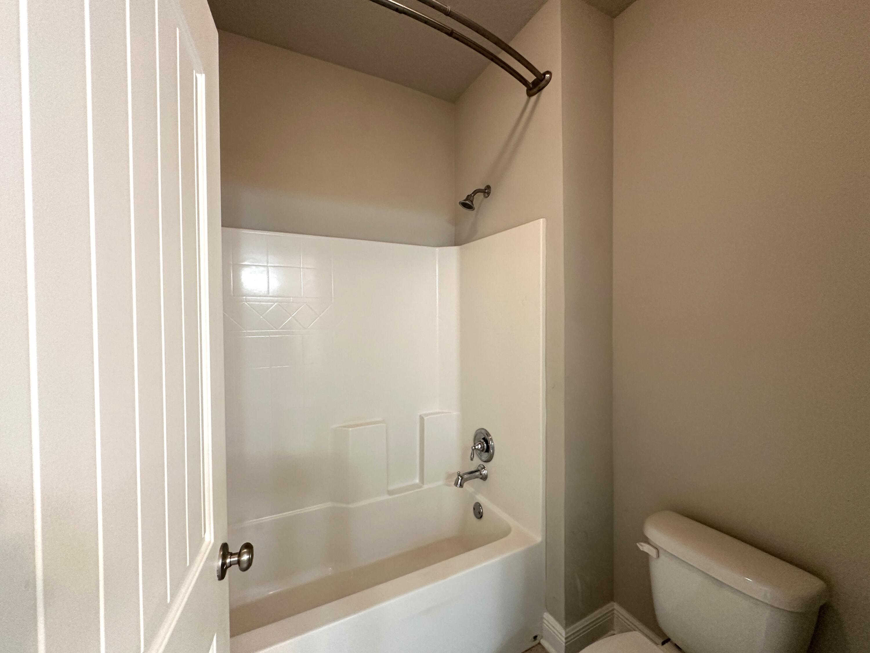 513 Gadwell Street Crestview, FL 32539 - Photo 24 of 35 a bathroom with a bathtub and a toilet