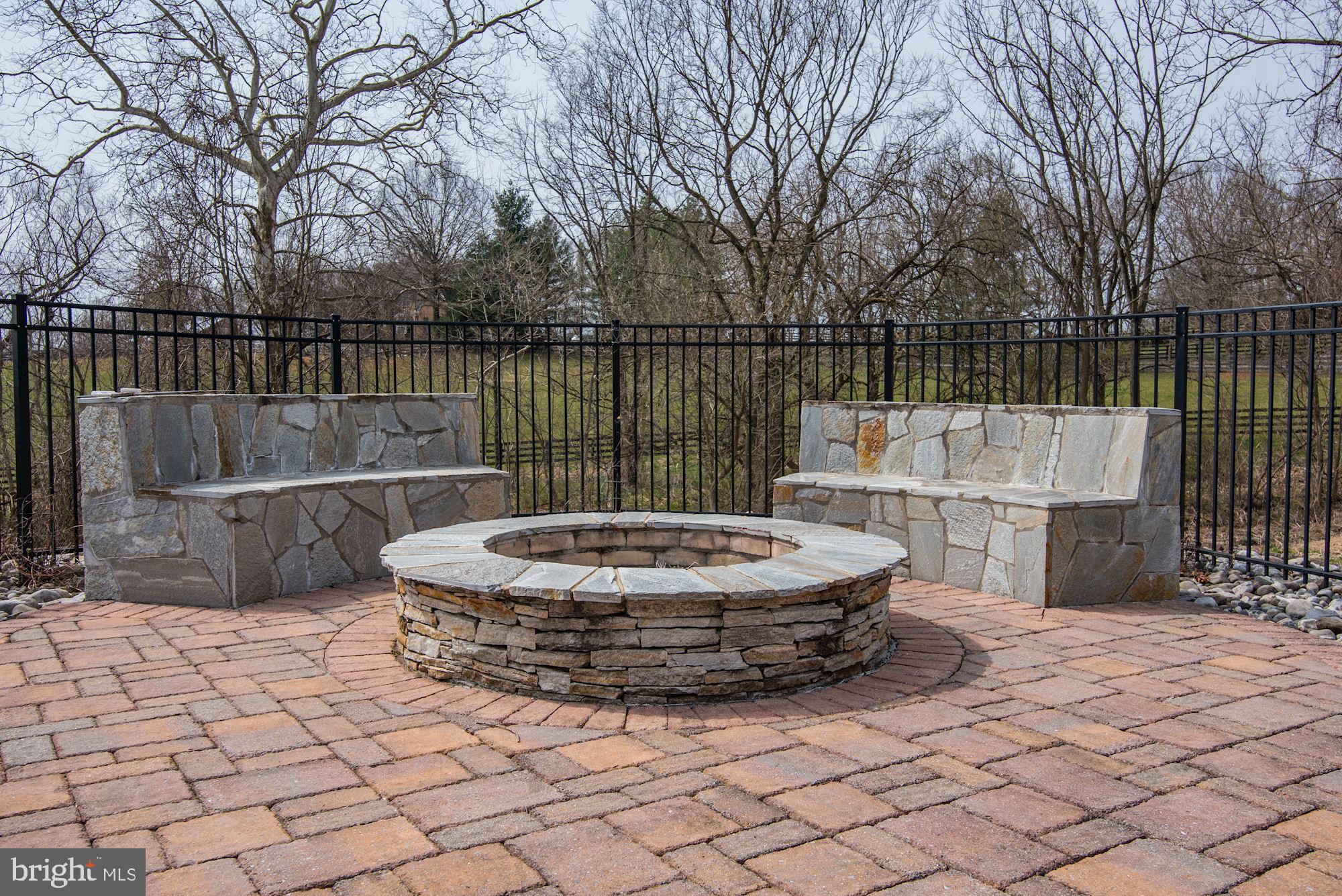 8728 Pete Wiles Road Middletown, MD 21769 - Photo 29 of 47 STONE SOFAS SURROUND THE FIRE PIT - HOT!