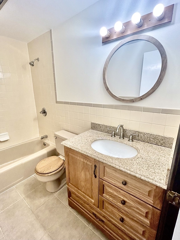 40 Corey Colonial, Unit 40 Agawam, MA 01001 - Photo 11 of 21 a bathroom with a toilet a sink and a mirror