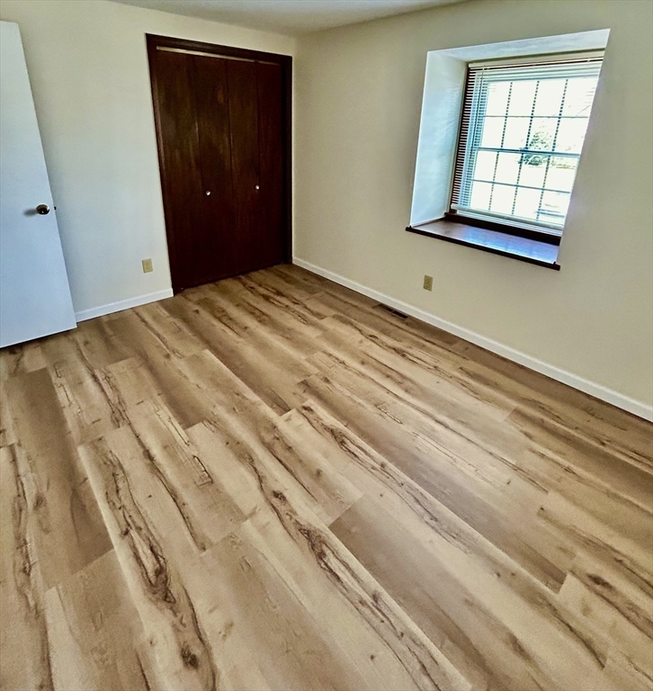 40 Corey Colonial, Unit 40 Agawam, MA 01001 - Photo 16 of 21 a bedroom with a bed and a window