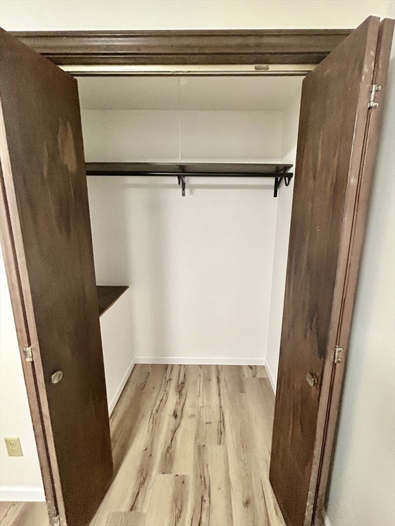 40 Corey Colonial, Unit 40 Agawam, MA 01001 - Photo 17 of 21 a view of a closet with wooden floor