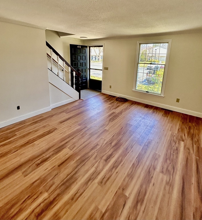 40 Corey Colonial, Unit 40 Agawam, MA 01001 - Photo 4 of 21 a view of an empty room with wooden floor and a window