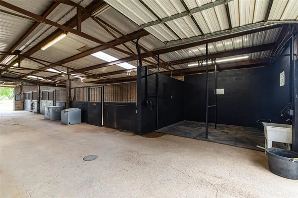 a view of empty room with wooden ceiling