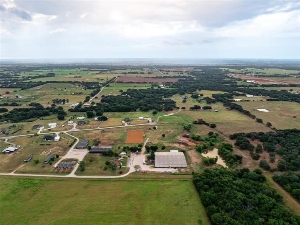 an aerial view of a house with a lake view