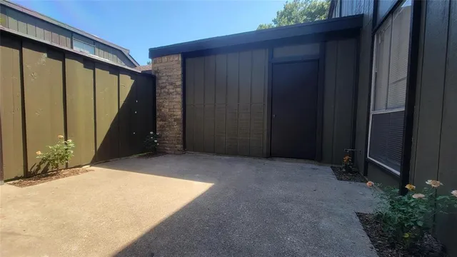 a view of backyard with tub and trees