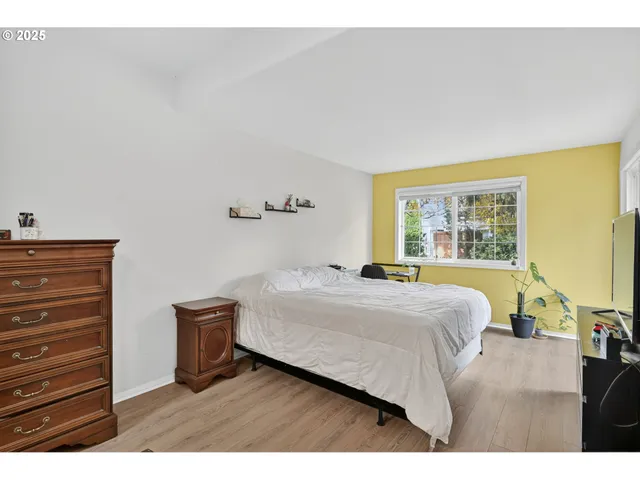 a bedroom with a bed and a dresser