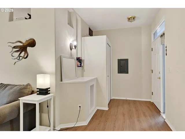 a view of kitchen with furniture and refrigerator