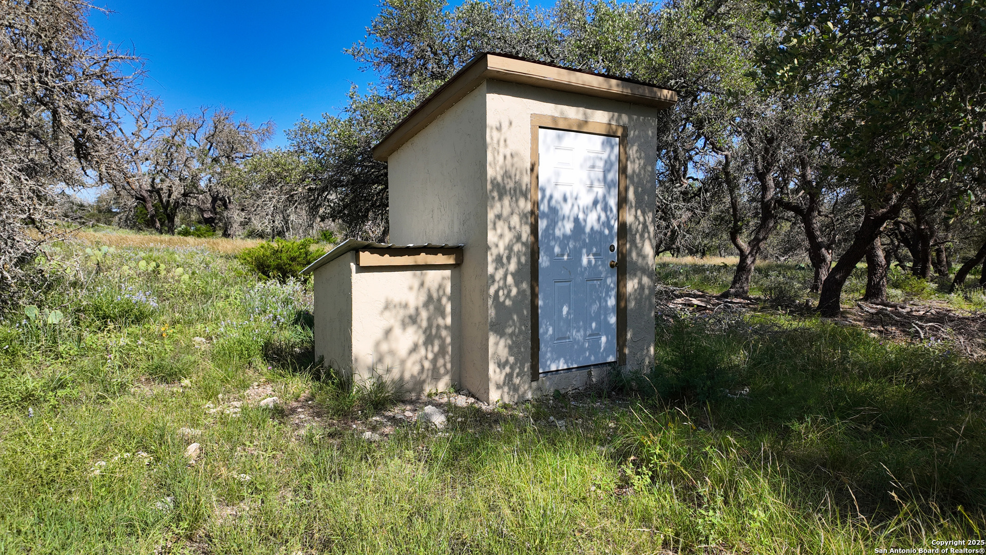857 Dallas Josie Road Harper, TX 78631 - Photo 10 of 25 a backyard of a house with lots of green space
