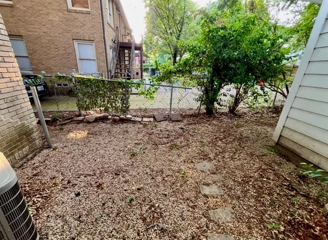 a backyard of a house with outdoor seating