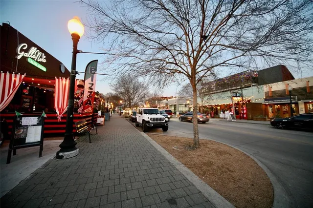 a view of a patio with swimming pool table and chairs