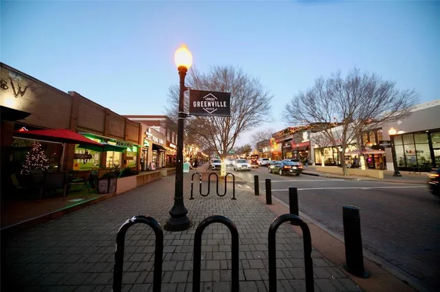 a view of a building with car parked
