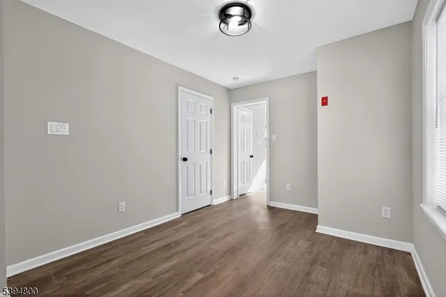 a view of a livingroom with wooden floor