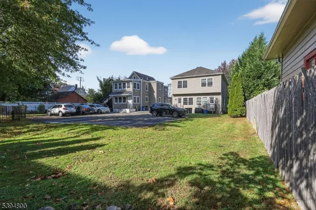 a swimming pool with outdoor seating and yard