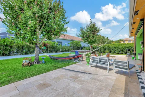 an aerial view of a house with a garden