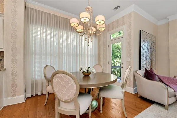a bedroom with furniture and a chandelier