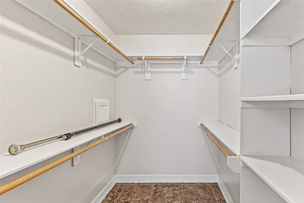 a view of a room with racks on the wall