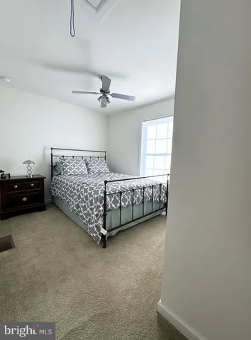 a bed room with a bed and a window