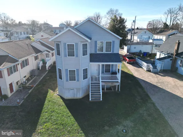 a aerial view of a house with a yard