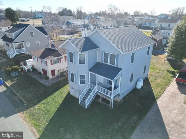 a aerial view of a house with a yard