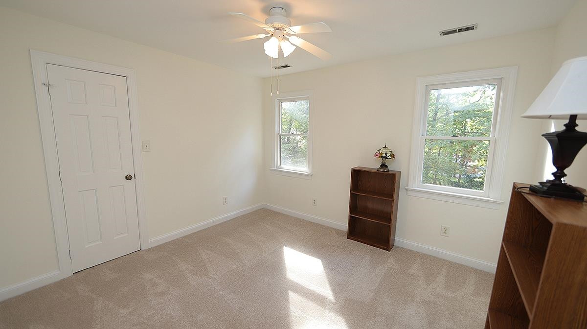 8700 Mourning Dove Road Raleigh, NC 27615 - Photo 25 of 30 Another Bedroom on the back side of the home. Great closet spaces in the house in addition to the walk up attic on this hall! 4th Bedroom