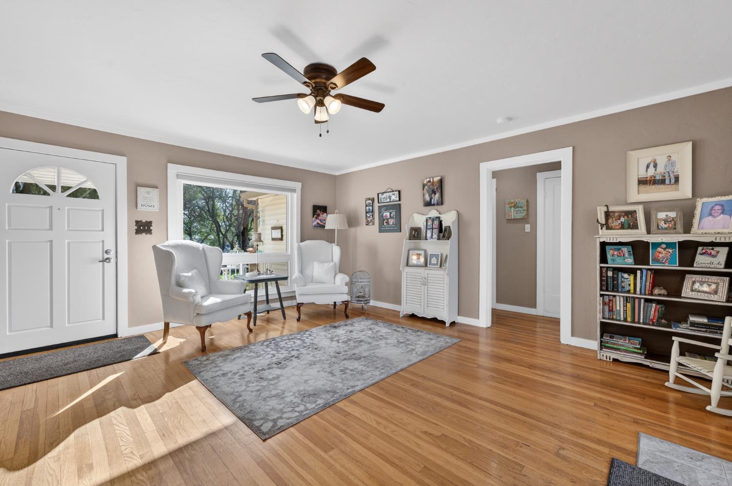 3740 Bell Road Auburn, CA 95602 - Photo 24 of 65 a living room with furniture and a book shelf