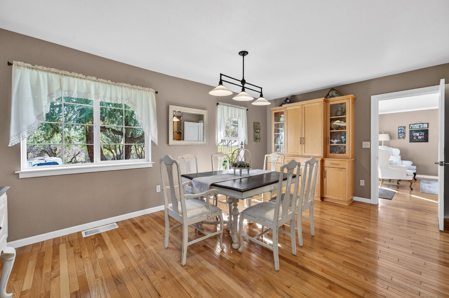 3740 Bell Road Auburn, CA 95602 - Photo 35 of 65 a view of a dining room with furniture window and wooden floor