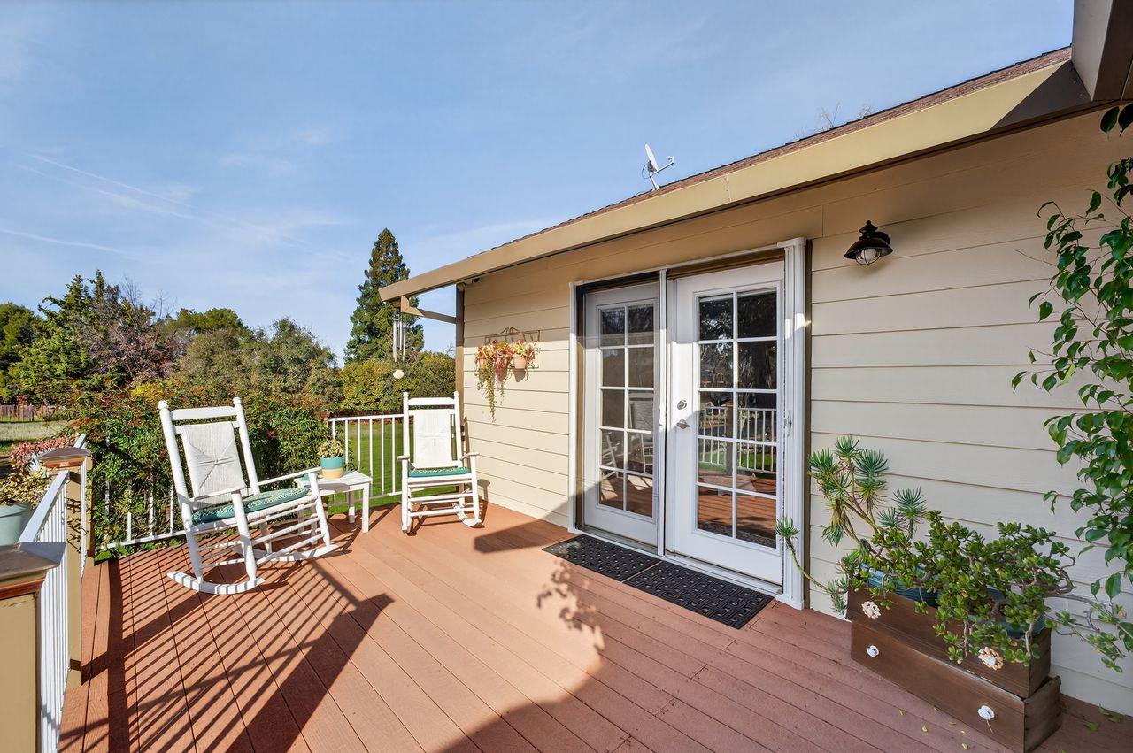 3740 Bell Road Auburn, CA 95602 - Photo 44 of 65 a balcony with wooden floor table and chairs