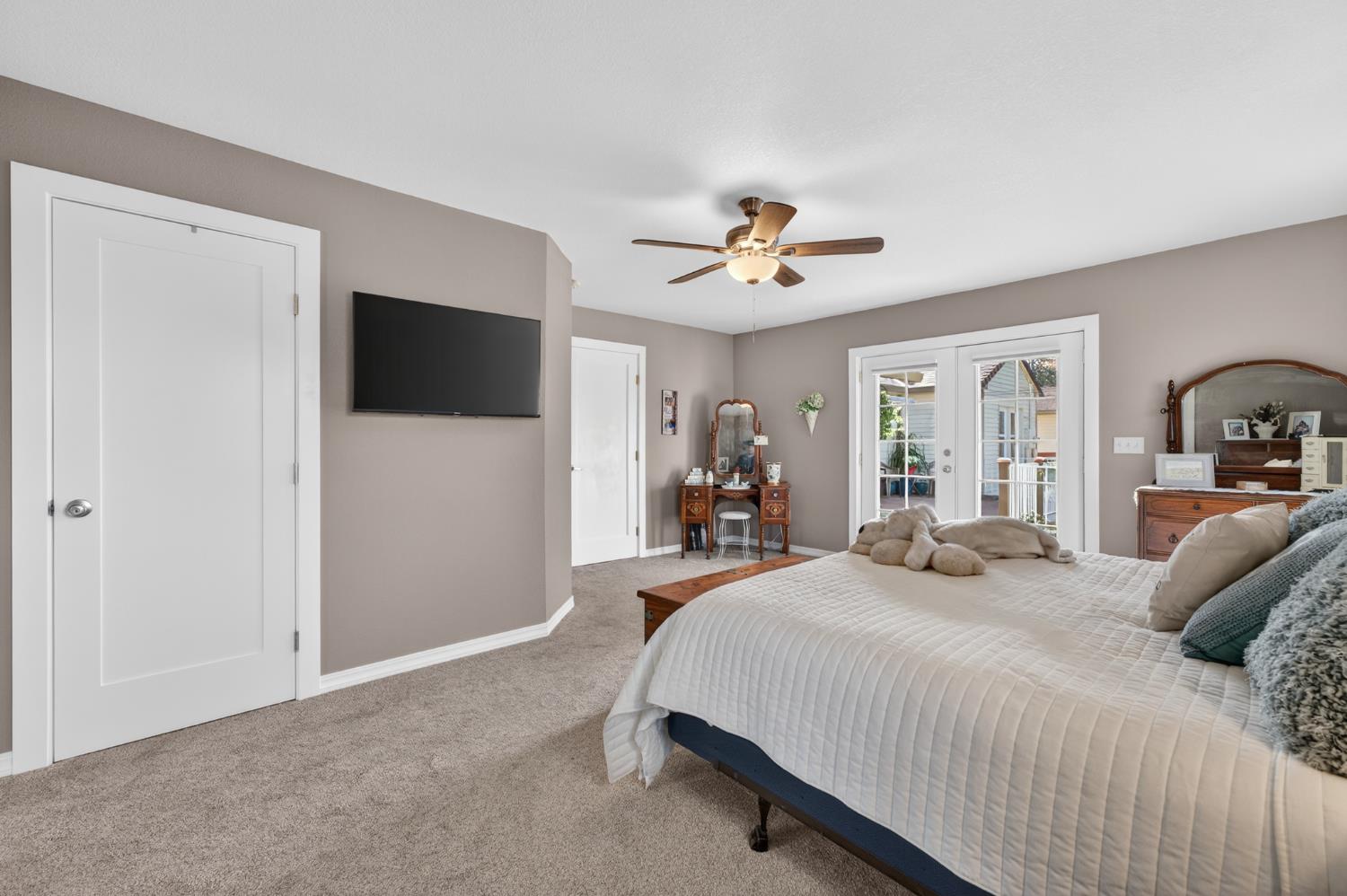 3740 Bell Road Auburn, CA 95602 - Photo 45 of 65 a bed room with a bed a television and dresser