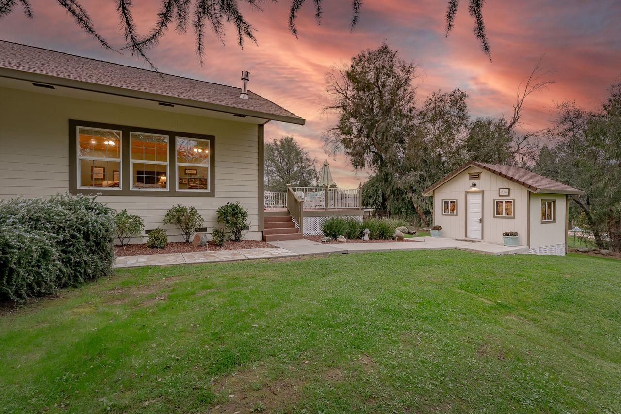 3740 Bell Road Auburn, CA 95602 - Photo 7 of 65 a front view of a house with a garden and porch