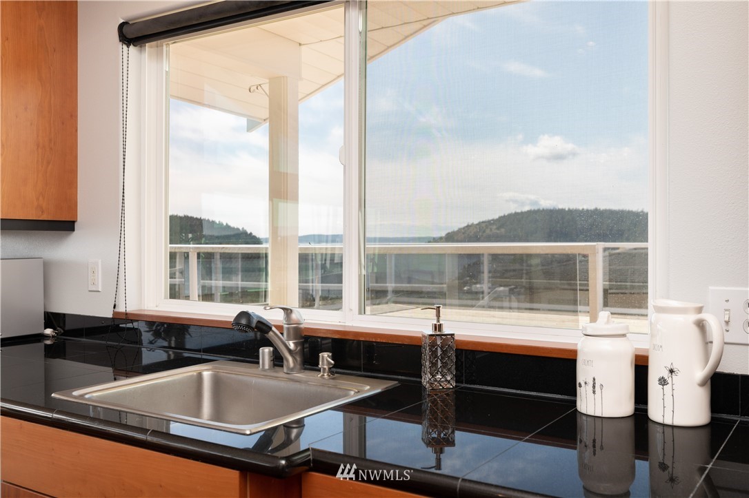 4913 Dundee Drive Anacortes, WA 98221 - Photo 16 of 40 a kitchen with a large window and sink