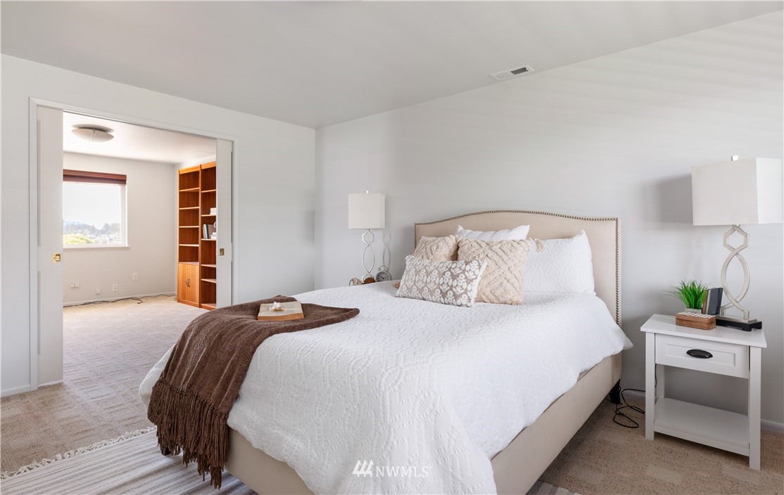 4913 Dundee Drive Anacortes, WA 98221 - Photo 19 of 40 a bedroom with a bed and a window