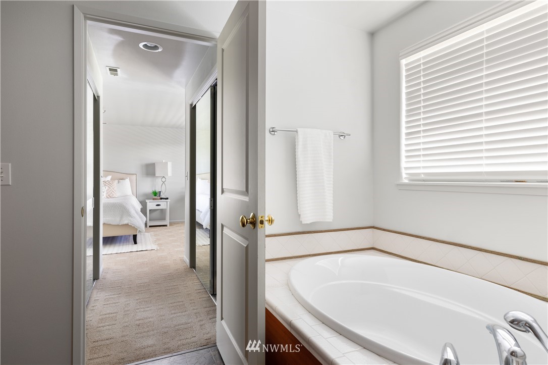 4913 Dundee Drive Anacortes, WA 98221 - Photo 22 of 40 a en suite bathroom with a tub shower and bedroom