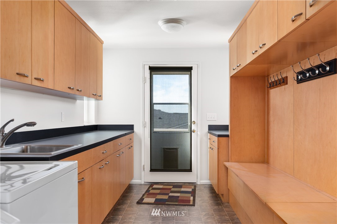 4913 Dundee Drive Anacortes, WA 98221 - Photo 26 of 40 a kitchen with a refrigerator and a sink