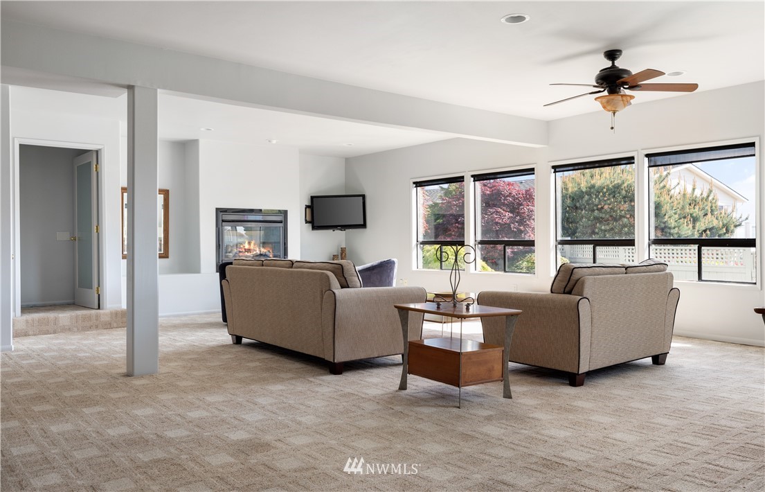 4913 Dundee Drive Anacortes, WA 98221 - Photo 28 of 40 a living room with furniture and a flat screen tv