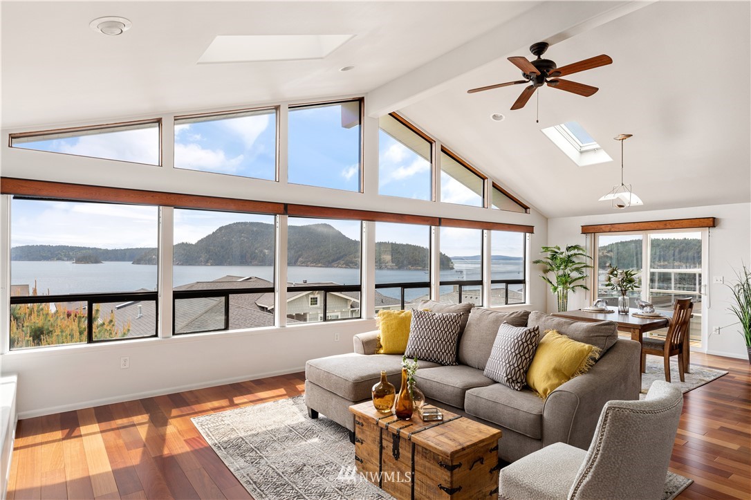 4913 Dundee Drive Anacortes, WA 98221 - Photo 8 of 40 a living room with furniture large window and ceiling fan