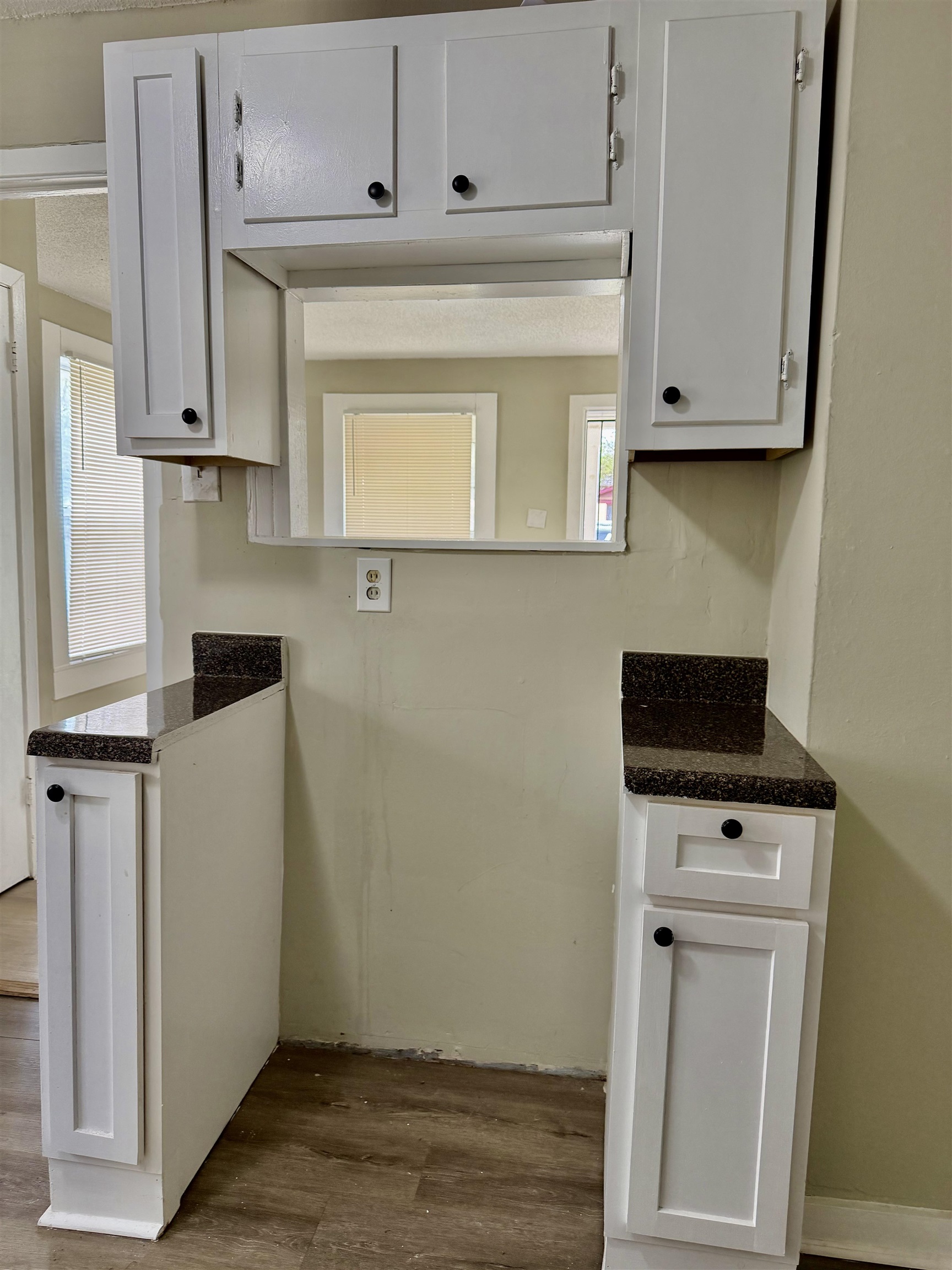 1448 Menager Road Memphis, TN 38106 - Photo 5 of 17 a kitchen with white cabinets and white appliances