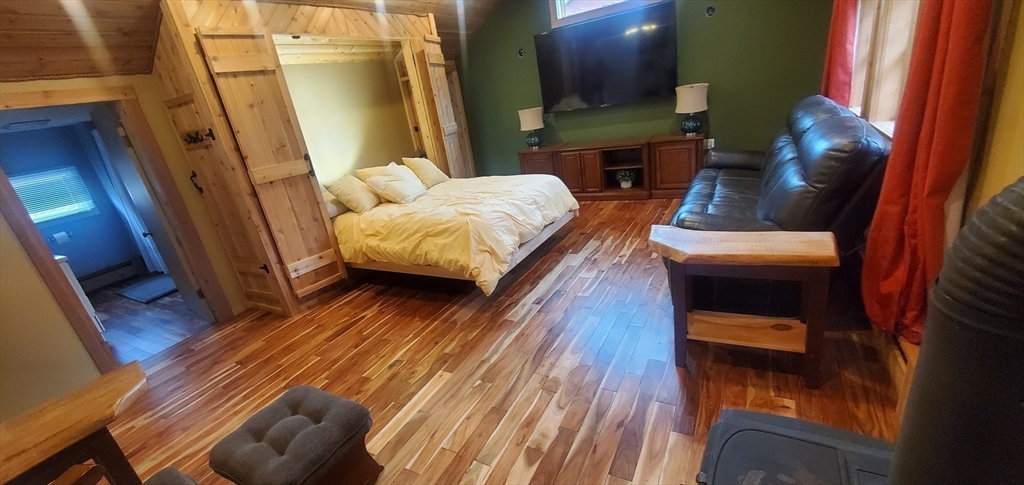 7 Strong Road Southampton, MA 01073 - Photo 24 of 42 a bedroom with a bed and a mirror
