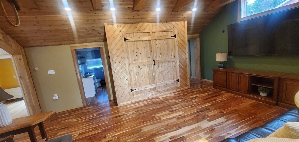 7 Strong Road Southampton, MA 01073 - Photo 25 of 42 a view of a livingroom with wooden floor and a fireplace