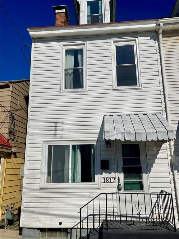 a view of house with deck