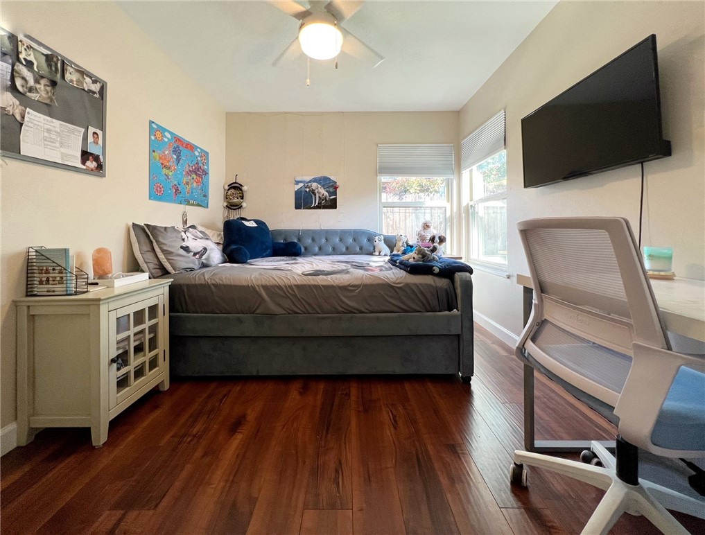 1807 Barbara Street Austin, TX 78757 - Photo 16 of 25 a bedroom with a bed and a flat screen tv