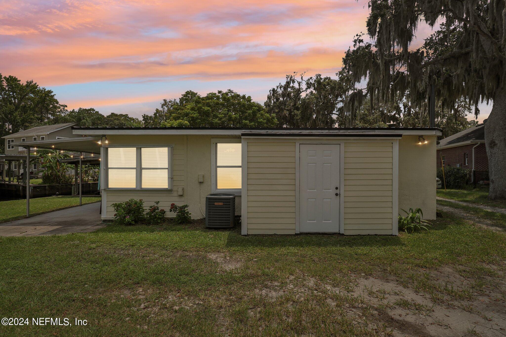 2870 Adams Road St. Augustine, FL 32092 - Photo 30 of 31 front view of house with a yard