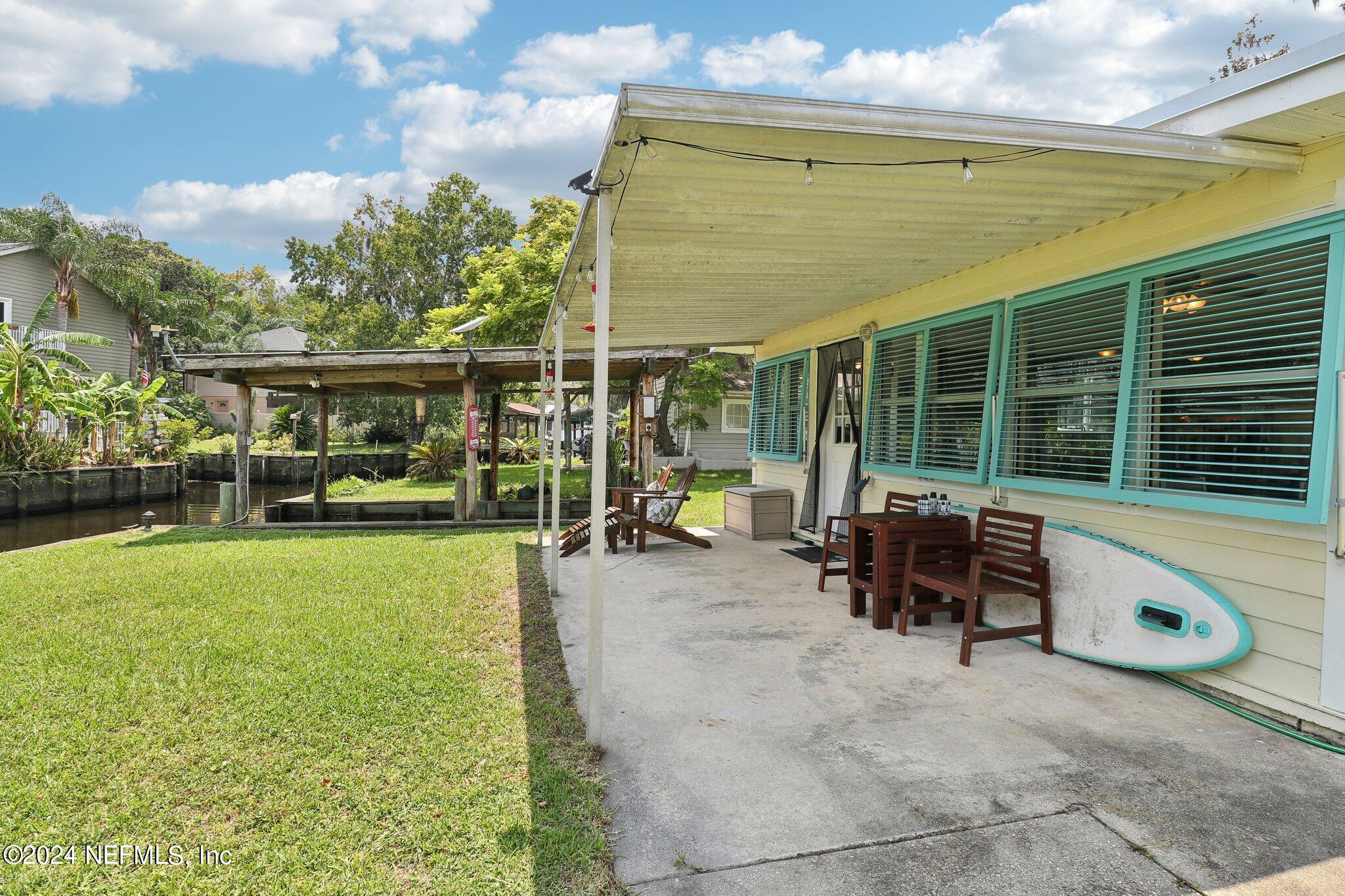 2870 Adams Road St. Augustine, FL 32092 - Photo 5 of 31 a view of a house with backyard porch and sitting area