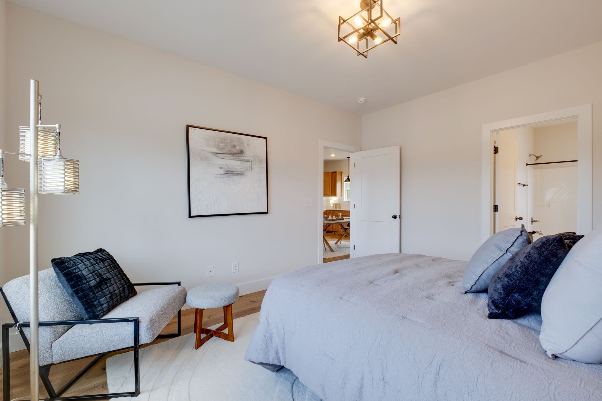 1280 Old County House Road Charlotte, TN 37036 - Photo 13 of 26 a spacious bedroom with a bed and a chandelier