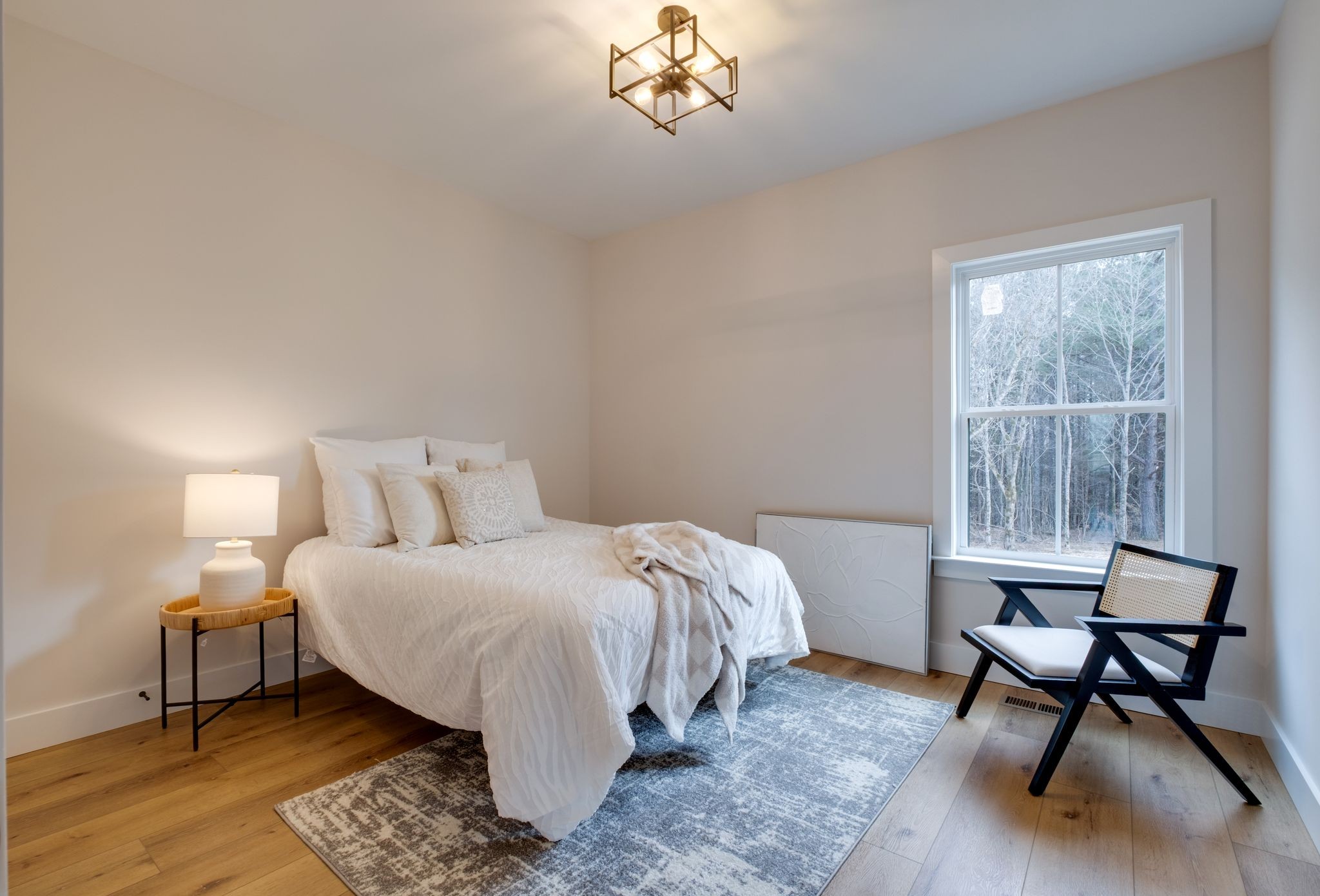 1280 Old County House Road Charlotte, TN 37036 - Photo 16 of 26 a bedroom with a bed a chair and a window