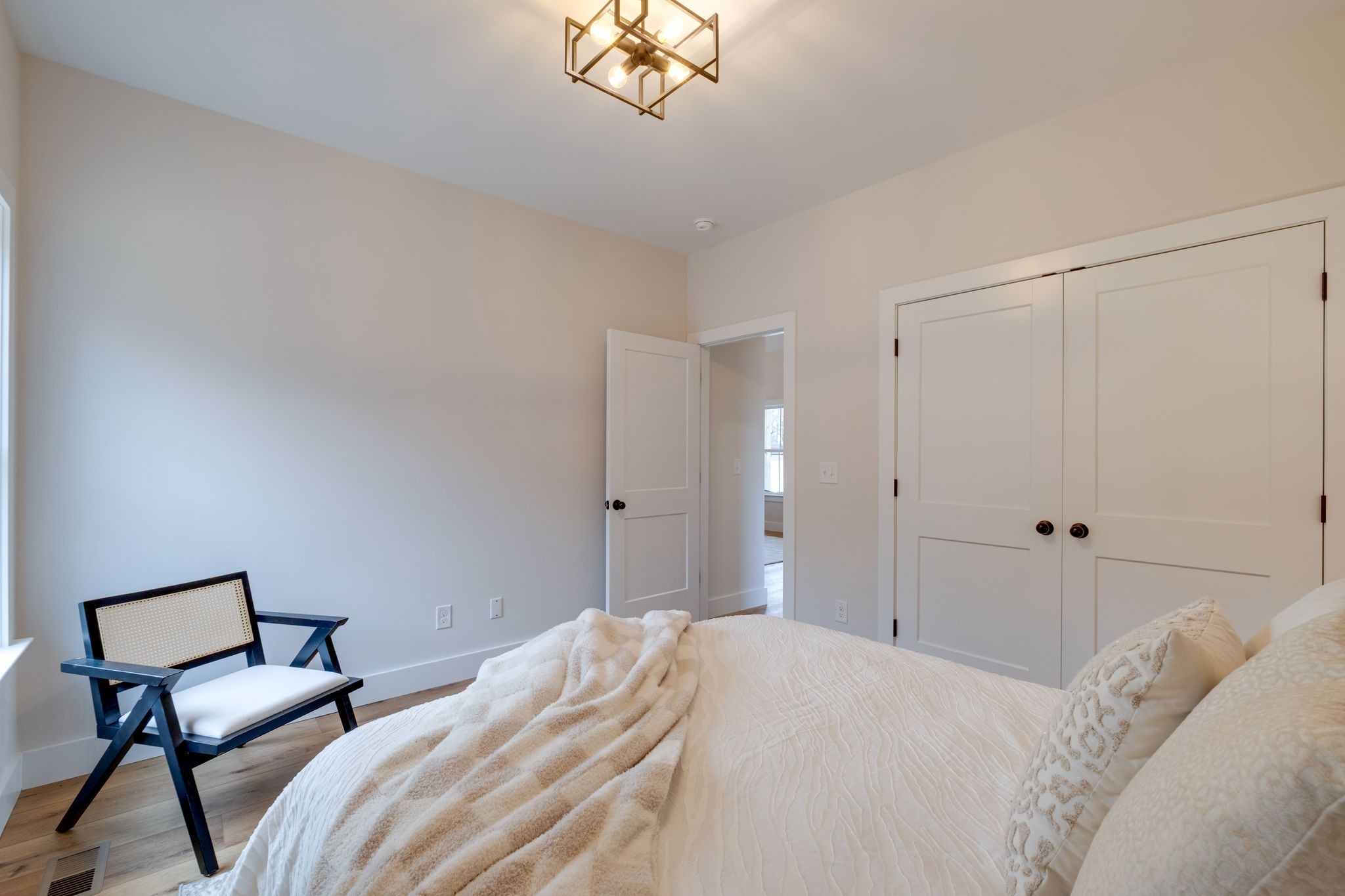 1280 Old County House Road Charlotte, TN 37036 - Photo 17 of 26 a bedroom with a bed and a chandelier