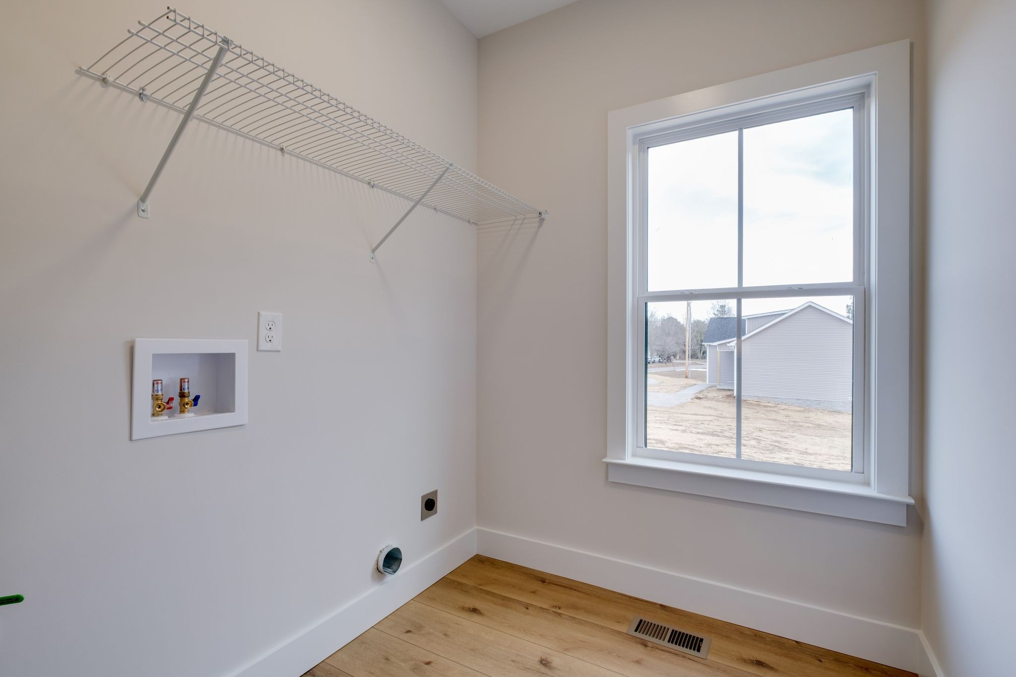 1280 Old County House Road Charlotte, TN 37036 - Photo 21 of 26 a room with a window and a wooden floor