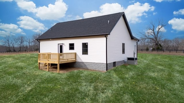 1280 Old County House Road Charlotte, TN 37036 - Photo 24 of 26 a backyard of a house with table and chairs