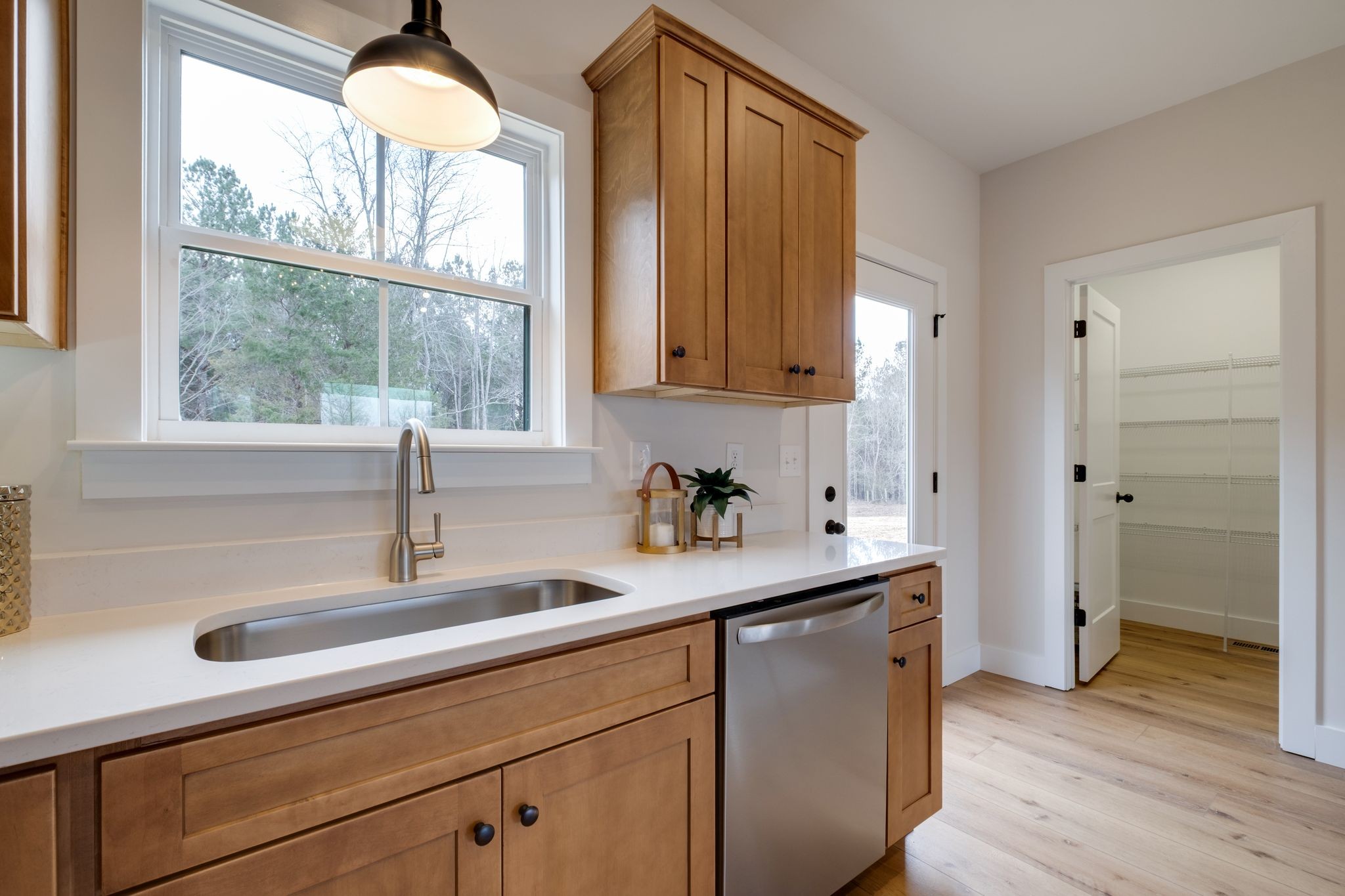 1280 Old County House Road Charlotte, TN 37036 - Photo 10 of 26 a kitchen with stainless steel appliances a sink a window and wooden floor
